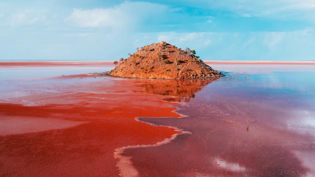 54/71Lake Ballard, Goldfields - Western  Australia
Forget about pink lakes. For a real dramatic addition to your Instagram, go to Lake Ballard, whose crimson #look is caused by the red mud and has onsite outback sculptures. Picture: Tourism Western Australia