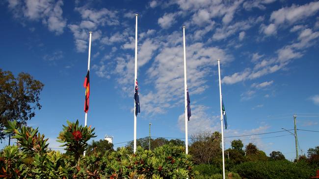 Flags fly at half mast at the Chinchilla Botanical Gardens in honour of constables Rachel McCrow and Matthew Arnold, who were murdered in cold blood 30 minutes southwest of the town. Picture: David Clark NCA/NewsWire