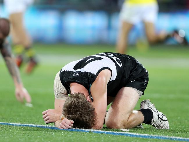 AFL - Friday, 16th October, 2020 - Preliminary Final - Port Adelaide v Richmond at the Adelaide Oval. Todd Marshall on the ground with Hamish Hartlett after the loss Picture: Sarah Reed