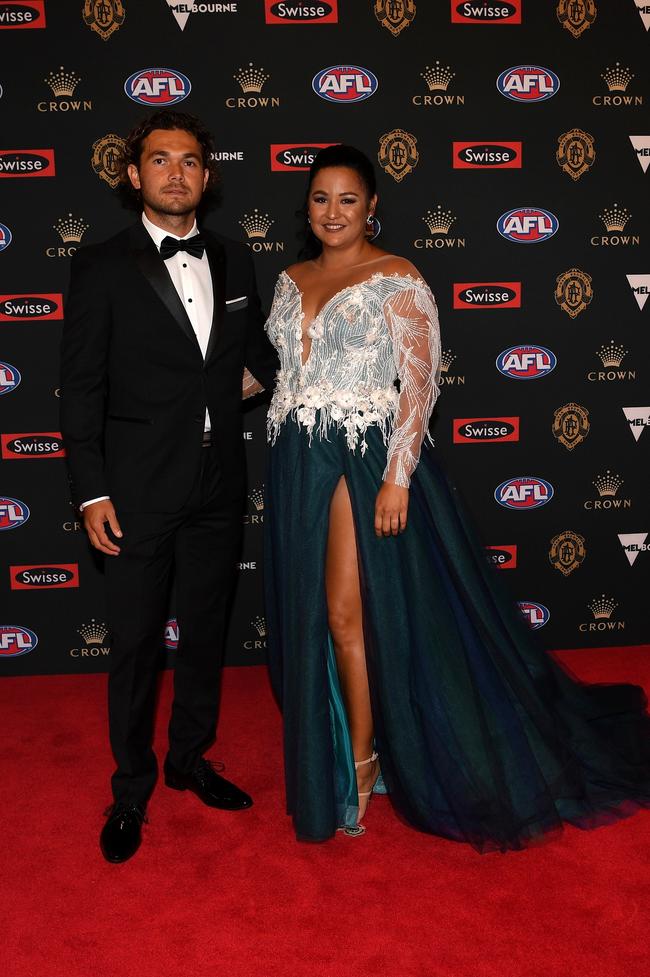 Jarrod Harbrow of Gold Coast and partner Emma Salam. Picture: AAP