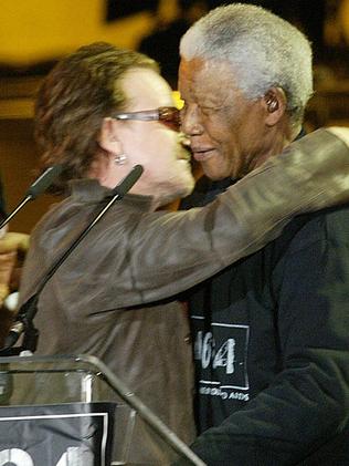 Bono hugs Nelson Mandela in Cape Town, 2003