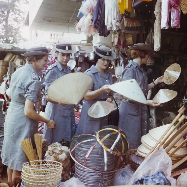 Rare moment off-duty ... the four browse in a Vietnam market.