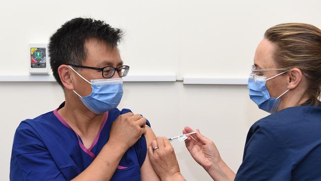 Prof Allan Cheng (left) was vaccinated against Covid-19 on Friday. Picture: Josie Hayden