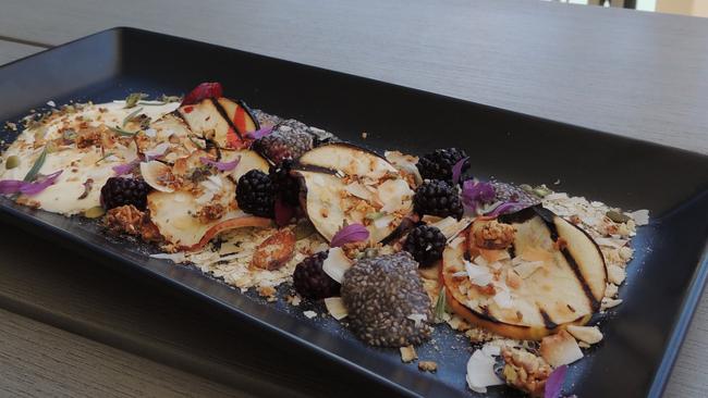 Breakfast platter with fruit, yoghurt, chia seeds, nuts and museli.