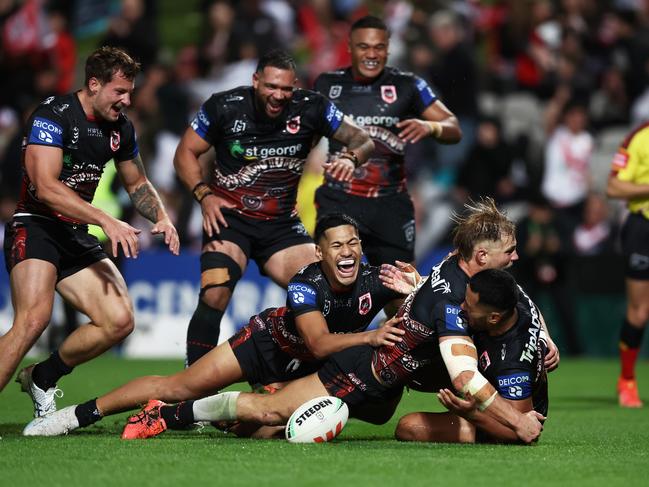 SYDNEY, AUSTRALIA - MAY 19:  Mathew Feagai of the Dragons celebrates with team mates after scoring the match winning try during the round 12 NRL match between St George Illawarra Dragons and Sydney Roosters at Netstrata Jubilee Stadium on May 19, 2023 in Sydney, Australia. (Photo by Matt King/Getty Images)