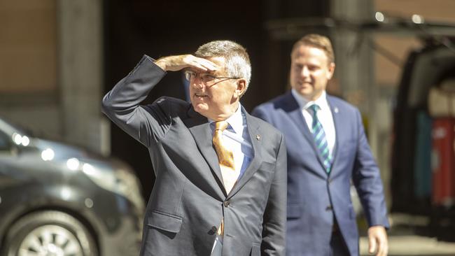 IOC president Thomas Bach (left) and Brisbane Lord Mayor Adrian Schrinner are seen taking a quick tour outside the Brisbane City Hall after a meeting with the Council of Mayors South East Queensland in Brisbane on Monday. Picture: AAP 