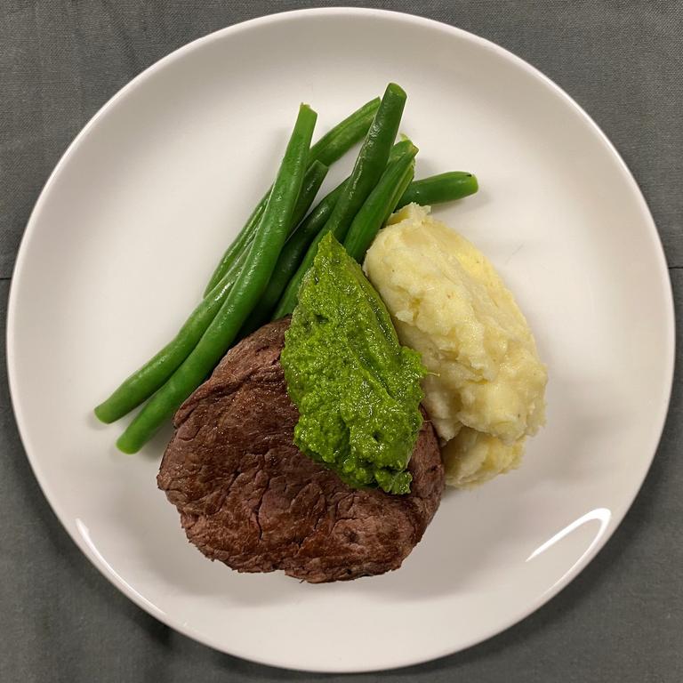 Beef fillet with Paris mash, green beans and salsa verde. Picture: Qantas