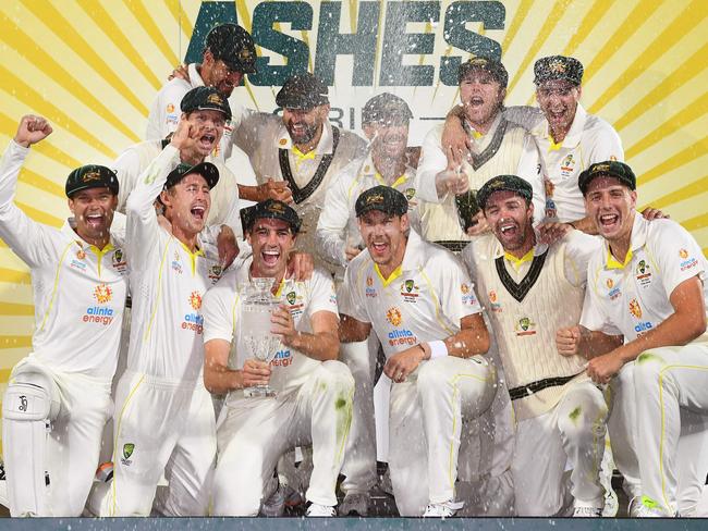 Australia's players celebrates with the trophy after defeating England in the 2022 Ashes on home soil. Picture: William West/AFP