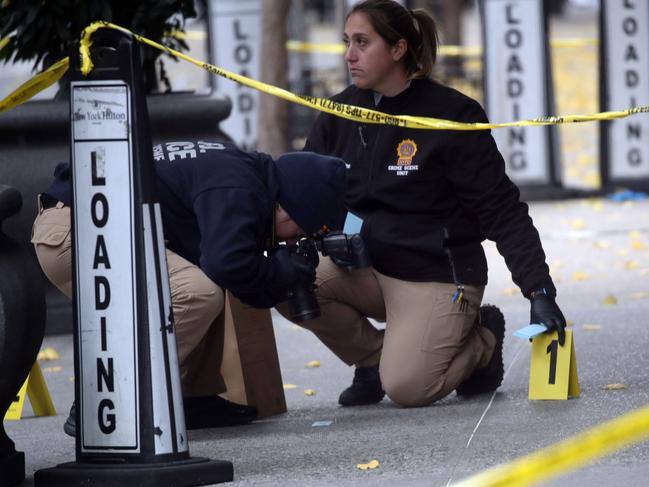 Police place bullet casing markers outside of a Hilton Hotel in Midtown Manhattan where United Healthcare CEO Brian Thompson was shot dead. Picture: /Getty Images/AFP