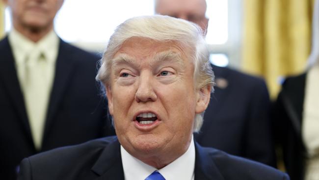 President Donald Trump speaks before signing an executive action in the Oval Office. Picture: AP