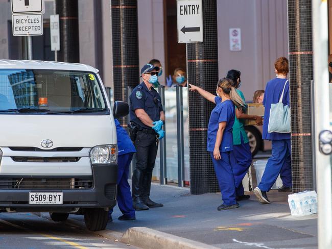 Police and SA Health staff outside Peppers on Tuesday. Picture: Matt Turner