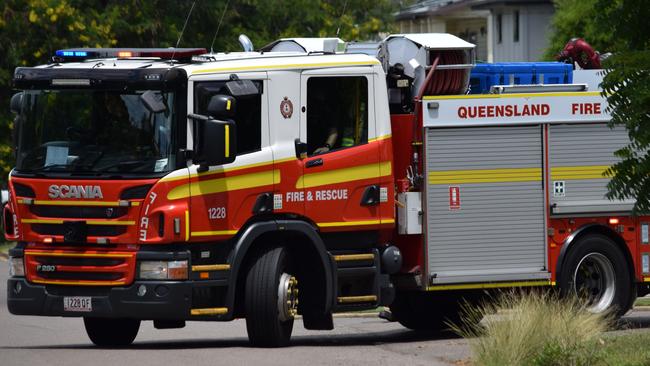 A Queensland Fire and Emergency Service fire truck in action.