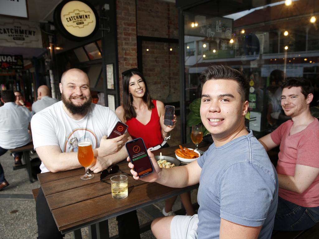 Fully vaccinated patrons (from left) Nick Avery, Tenesha Roue, Aiden Clark and Ethan Elms at Catchment Brewing Co in Brisbane’s West End on Friday evening. Picture: Josh Woning