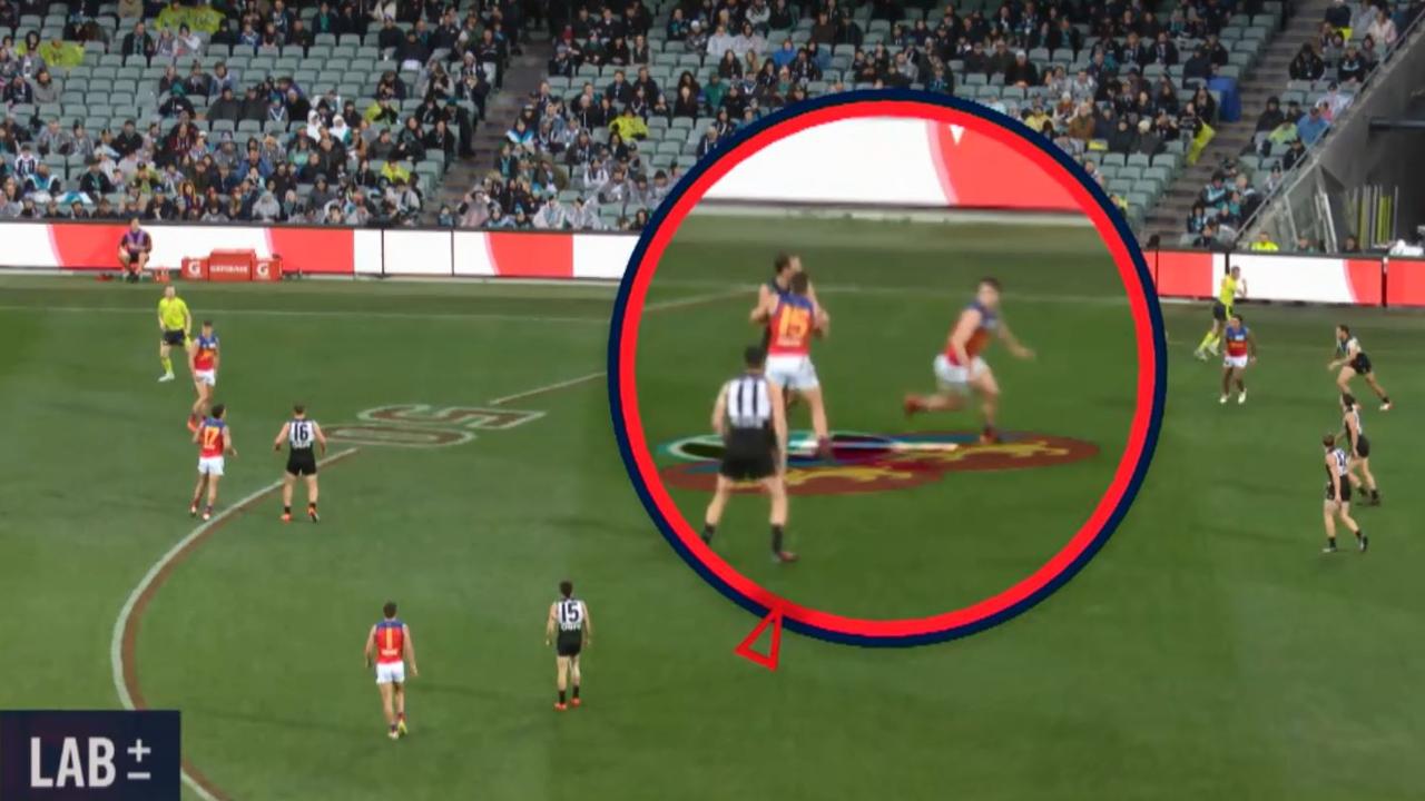 Dayne Zorko blocks Cam Sutcliffe.