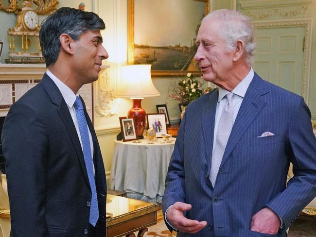 Britain's King Charles III (R) speaks with Britain's Prime Minister Rishi Sunak at Buckingham Palace, in central London, on February 21, 2024 for their first in-person audience since the King's diagnosis with cancer. (Photo by Jonathan Brady / POOL / AFP)