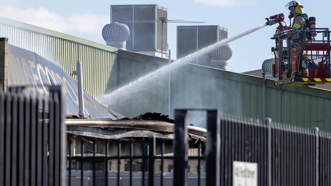 MFS had to use a cherry picker to tackle the blaze. Picture: Naomi Jellicoe