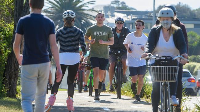 Joggers, walkers, cyclists and even a rollerblader were out at Brighton. Picture: Jay Town