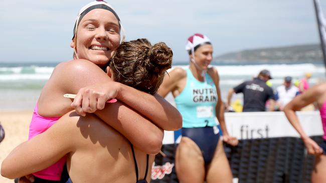 Round 1 winner Maddy Dunn is congratulated by fellow ironwoman Lizzie Welborn. Photo: Shane Myers