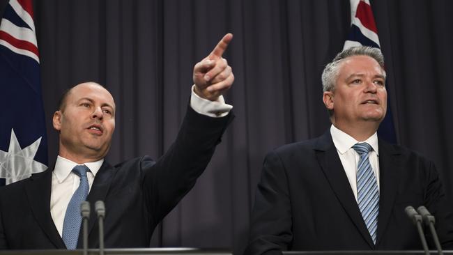 Josh Frydenberg (left) and Finance Minister Mathias Cormann speak during a press conference. Picture: AAP Image/Lukas Coch