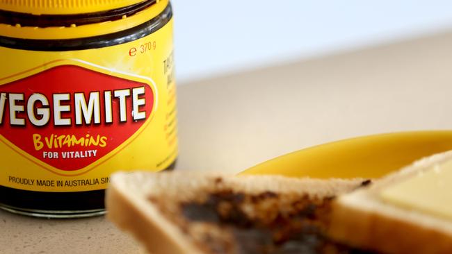 SYDNEY, AUSTRALIA - NewsWire Photos FEBRUARY 10, 2022: A jar of Vegemite and a Cheese and Vegemite sandwich. Vegemite is undertaking a fresh bid to appeal to wider audiences with the launch of a new cheesy staple. Vegemite & Cheese, made up of the original spread mixed with cream cheese, is aimed at customers who have yet to try the Australian delicacy. The new offering is set to replace Cheesybite and will roll out across supermarkets from Thursday.Picture: NCA NewsWire / Damian Shaw