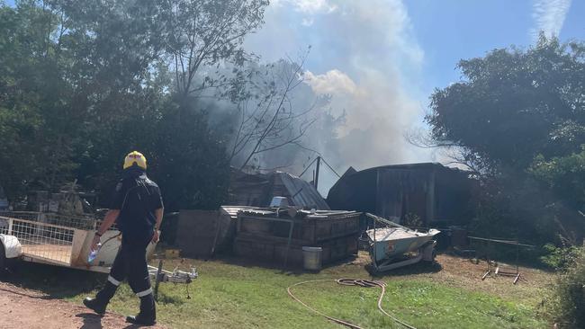 Queensland Fire Department crew member inspects the Roseneath blaze. Picture: Leighton Smith.