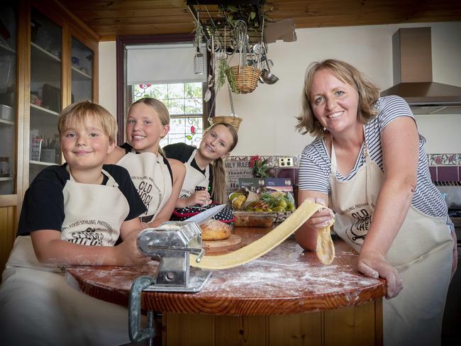 Chef Eloise Emmett cooking with her children Oscar, 8, Stephanie, 11, and Maggie, 14, in early 2023. Picture: Chris Kidd