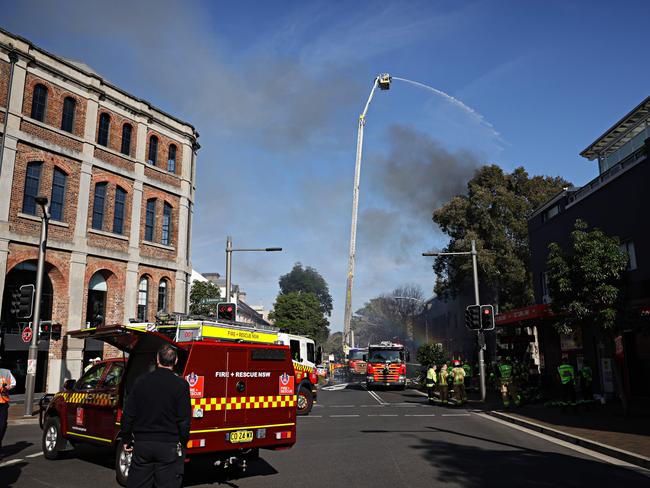 Emergency services attend to a unit block fire on Abercrombie st, Redfern near Lawson St. Picture: Adam Yip