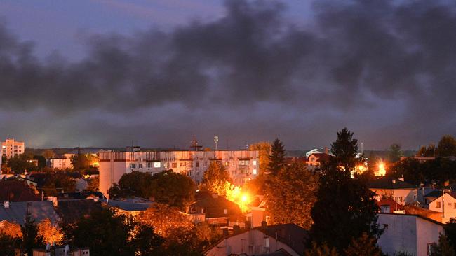 Black smoke billows over the city after drone strikes in the western Ukrainian city of Lviv.