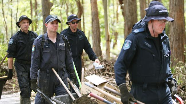 Police clear scrub to make way for the digger on Batar Creek Road during a search. Picture: NCA NewsWire / Peter Lorimer.