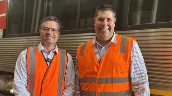 State member for Maryborough John Barounis and Minister for Transport and Main Roads Brent Mickelberg at Maryborough's Downer rail factory.