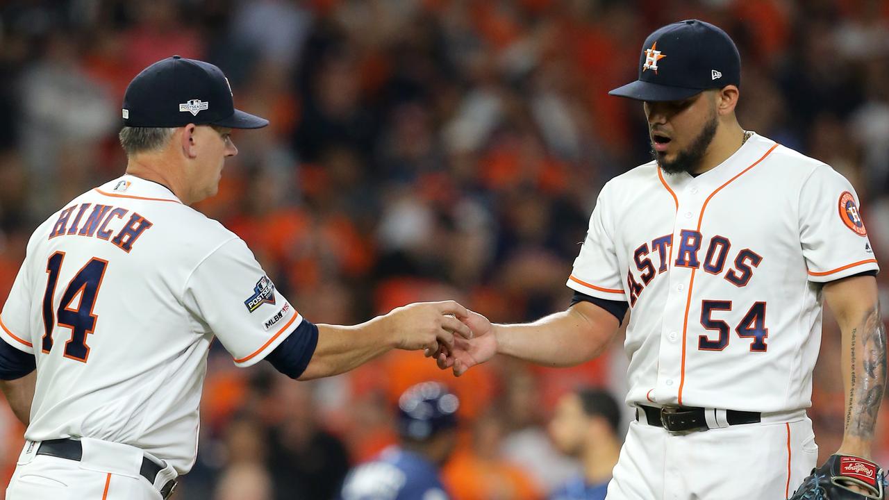 Astros Manager A.J. Hinch (left) has lost his job.