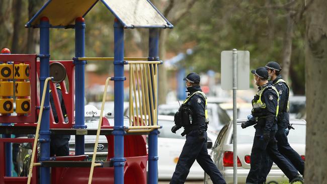 Police patrol a children’s playground at the height of the pandemic.