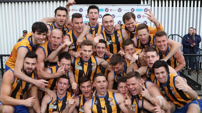 St Bernards celebrates its thumping grand final win over Old Carey. Picture: David Crosling