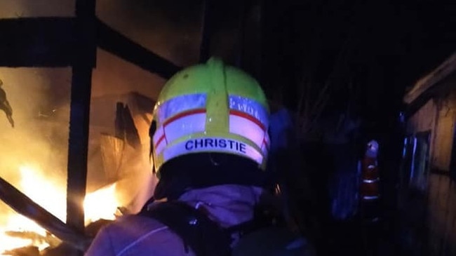 DIRECT ATTACK: Firefighters from Fire and Rescue and Rural Fire Service fought a direct attack to save houses on either side of a blazing property at Broadwater.