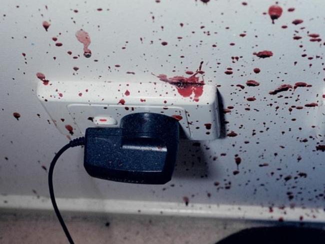 The mobile phone charger and bedroom wall was covered in blood. Picture: Supreme Court of NSW