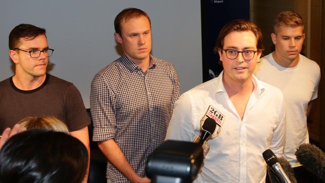 Eight of the Budgie Nine have returned to Australia from Maylasia. L-R: Timothy Yates, Tom Laslett,  Nick Kelly and Edward Leany address media at Sydney International Airport.