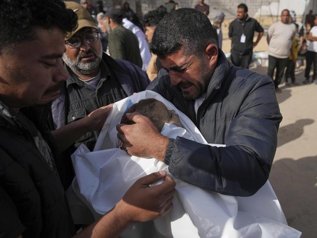 Mohannad Al-Agha, holds body of his niece Zeina Al- Agha, 2, killed in an overnight Israeli airstrike, during her funeral at Nasser Hospital in Khan Younis, Gaza Strip, Sunday, May 11, 2025. Picture: AP Photo/Abdel Kareem Hana