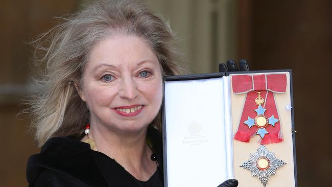 The author holds her Dame Commander of the British Empire medal presented to her by the then Prince of Wales for services to literature at an Investiture ceremony at Buckingham Palace on February 6, 2015. Picture: Getty Images