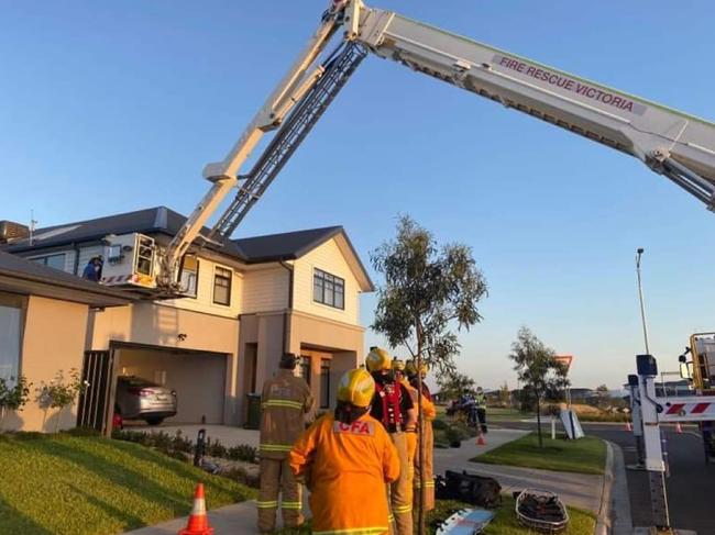 A cherry picker was called in to rescue a Werribee man stuck on his garage after he fell from a second story roof while installing a TV antenna. Picture: Supplied.