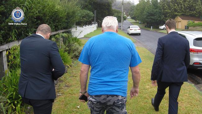 Police arrest Wayne Astill, centre, following Strike Force Nautilus investigations.