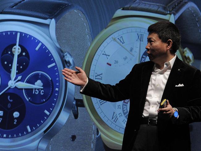 Huawei's Consumer Business Group Chief Executive Officer (CEO) Richard Yu presents his company's new device "Huawei Watch" during a press conference in Barcelona on March 1, 2015 the eve of the 2015 Mobile World Congress opening. Phone makers will seek to seduce new buyers with even smarter Internet-connected watches and other wireless gadgets as they wrestle for dominance at the world's biggest mobile fair starting tomorrow. AFP PHOTO / JOSEP LAGO