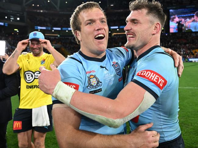 BRISBANE, AUSTRALIA - JULY 17: Jake Trbojevic and Angus Crichton of the Blues celebrate victory following game three of the 2024 Men's State of Origin series between Queensland Maroons and New South Wales Blues at Suncorp Stadium on July 17, 2024 in Brisbane, Australia. (Photo by Bradley Kanaris/Getty Images)