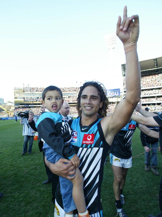 Peter and Trent Burgoyne after the 2004 grand final.