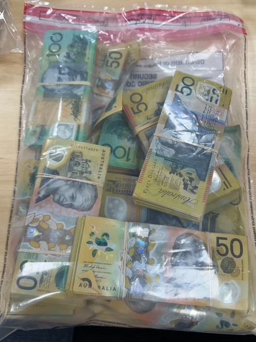 Two people charged with trafficking after police seized more than half a kilo of ice and $100k in cash in a targeted operation. Image: Tasmania Police