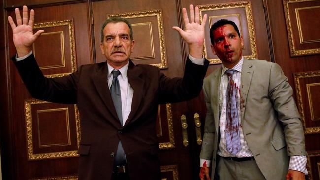 Opposition politicians Luis Stefanelli and Leonardo Regnault after a group of government supporters burst into Venezuela’s opposition-controlled National Assembly.