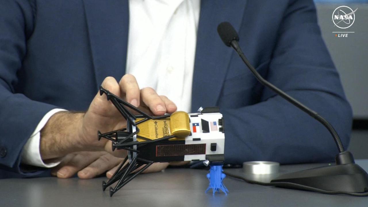 Intuitive Machines CEO Steve Altemus holds a model of Odysseus to show its position on its side during a press conference at Johnson Space Center in Houston, Texas on February 23. Picture: Handout/NASA TV/AFP