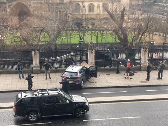 The car crashed into this fence after ploughing through people on Westminster Bridge. Picture: James West via AP)