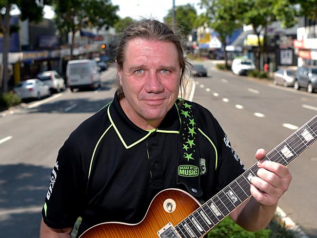 Will Nambour develop as a centre for music with plans to locate USC's Communication and Creative Arts School in the town and potentially at the council chambers.Mark Higgins from Shake It Up Music rocking out in Nambour's main street.