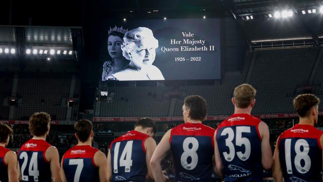 Players observe a minutes silence in memory of Her Majesty Queen Elizabeth II. Picture: Michael Willson/AFL Photos via Getty Images