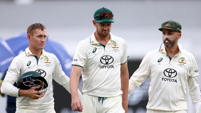 Josh Hazlewood (centre) succumbed to injury, while Marnus Labuschagne (left) largely failed to impress. (Photo by DAVID GRAY / AFP)